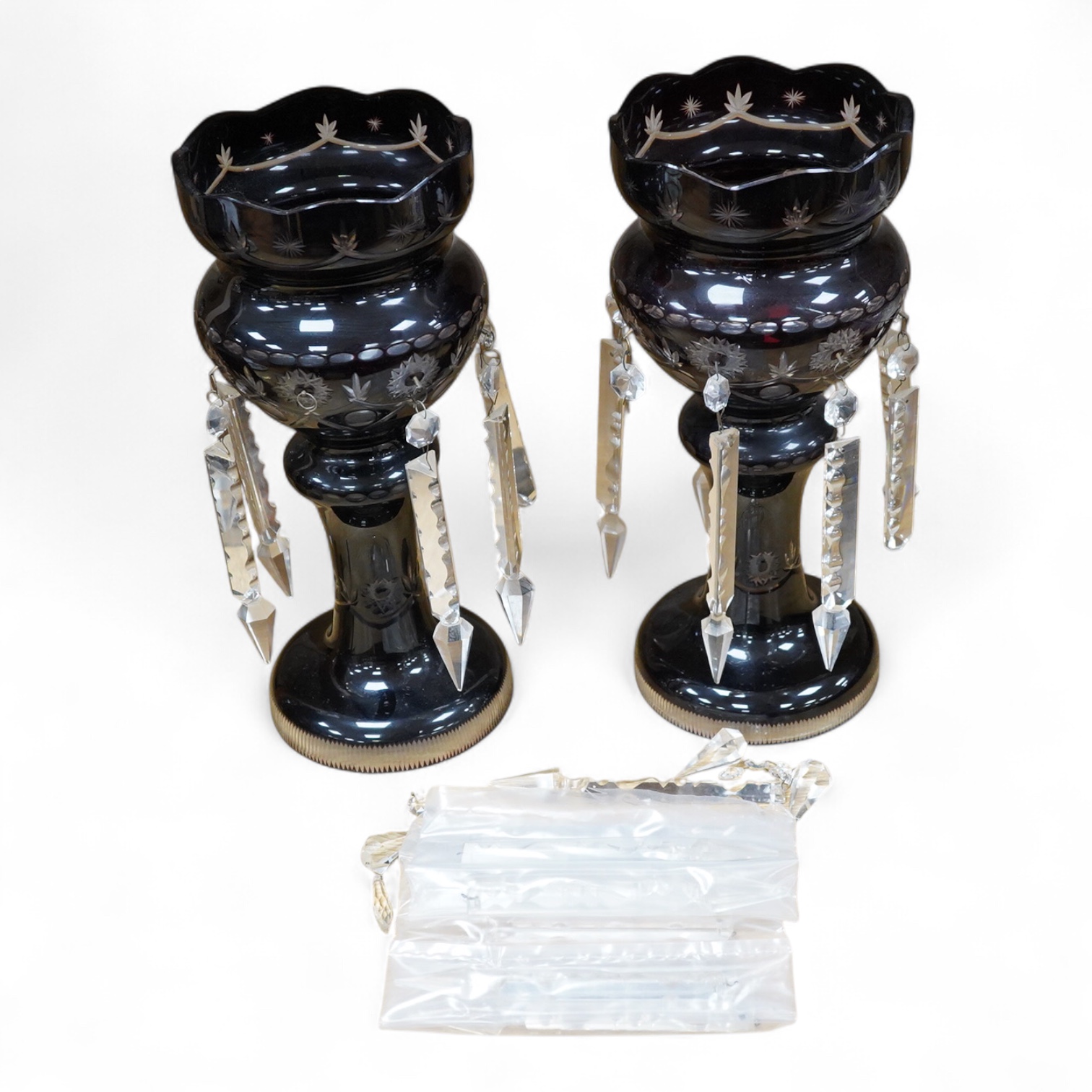 A pair of 19th/20th century deep ruby flashed cut glass lustres, 36cm high